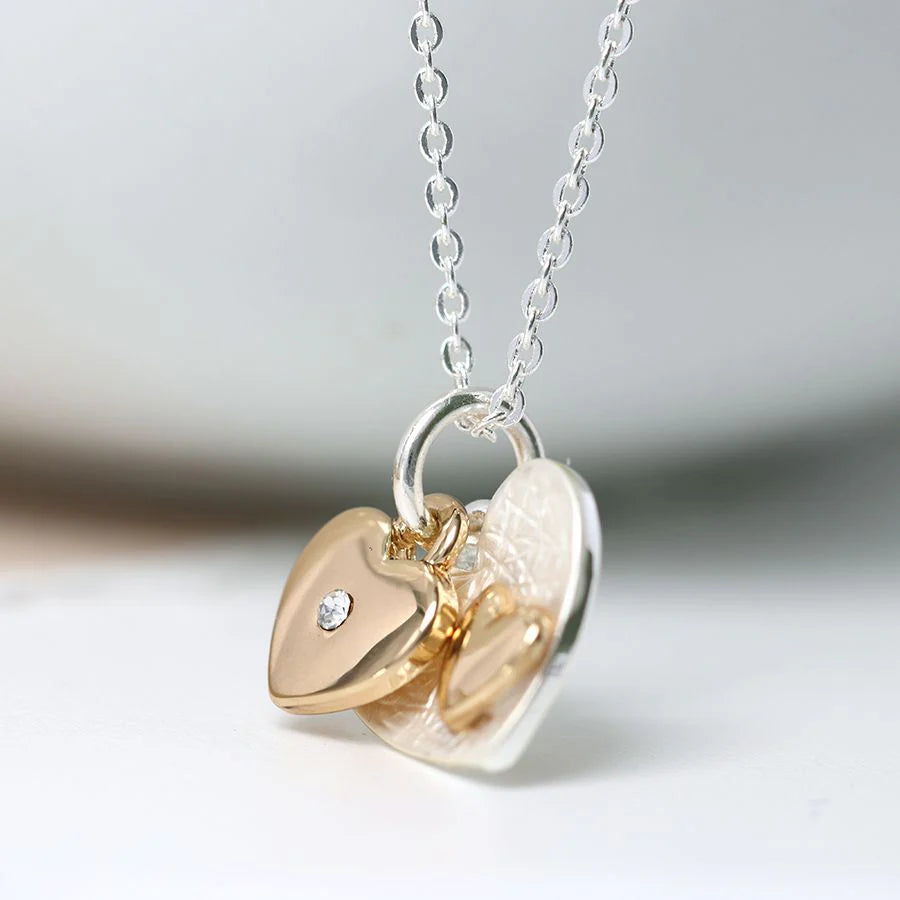 Necklace with heart-shaped pendants on a light background