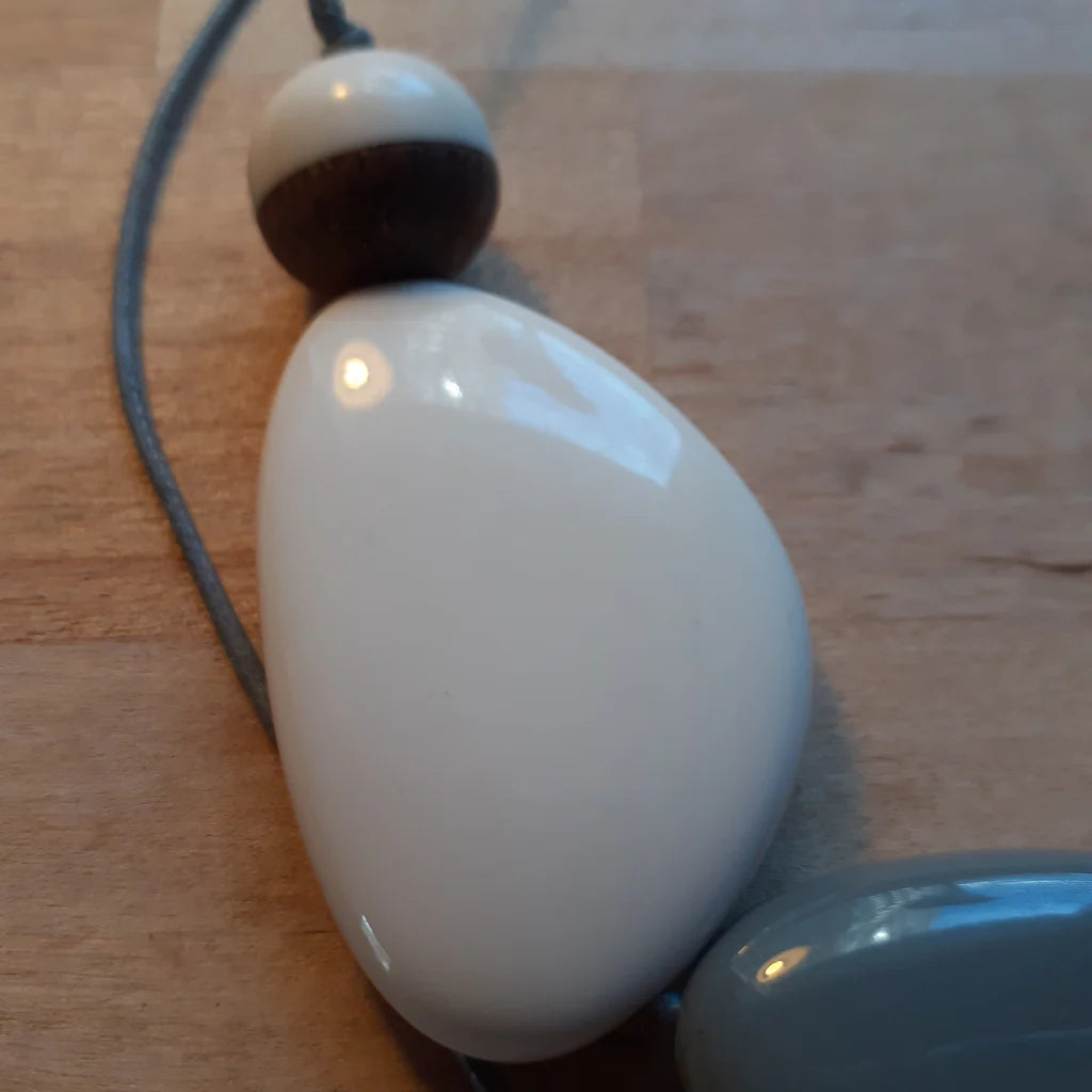 Close-up of a white electronic device on a wooden surface
