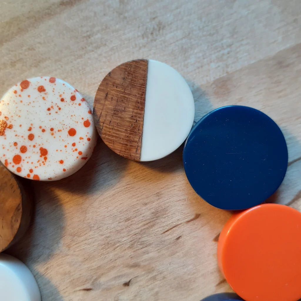 Colorful circular objects on a wooden surface