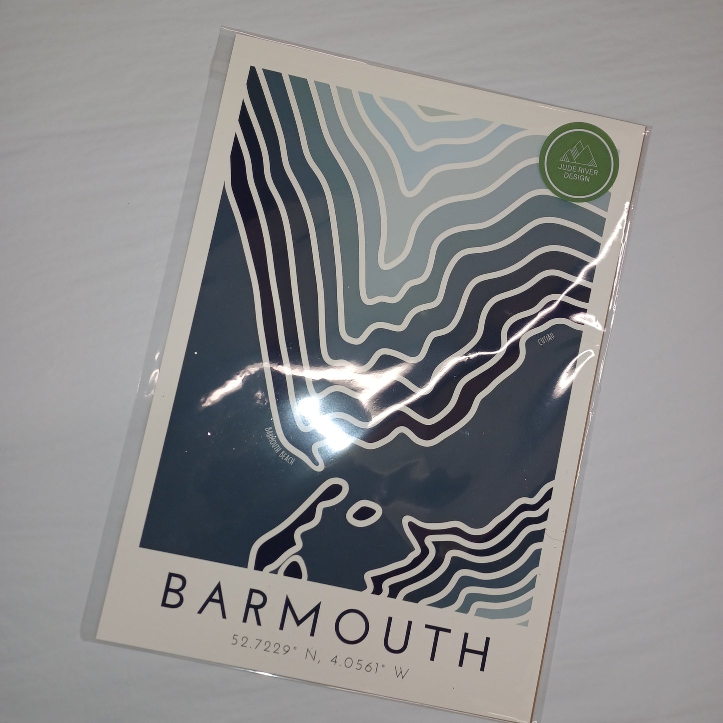 Poster with topographic design and 'Barmouth' text on a gray background