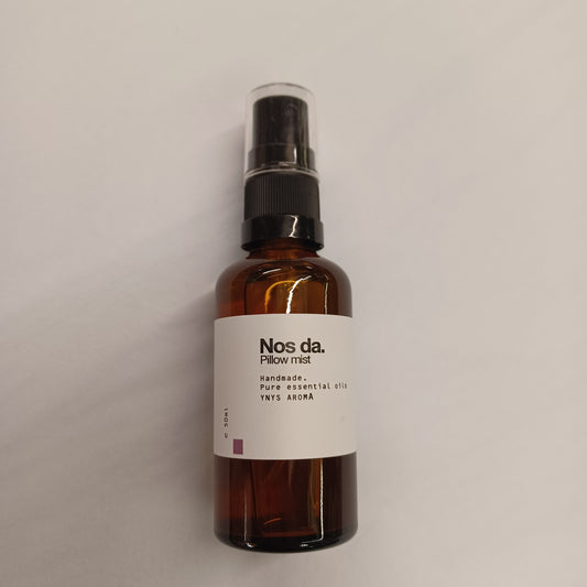 Brown spray bottle with a label on a white background