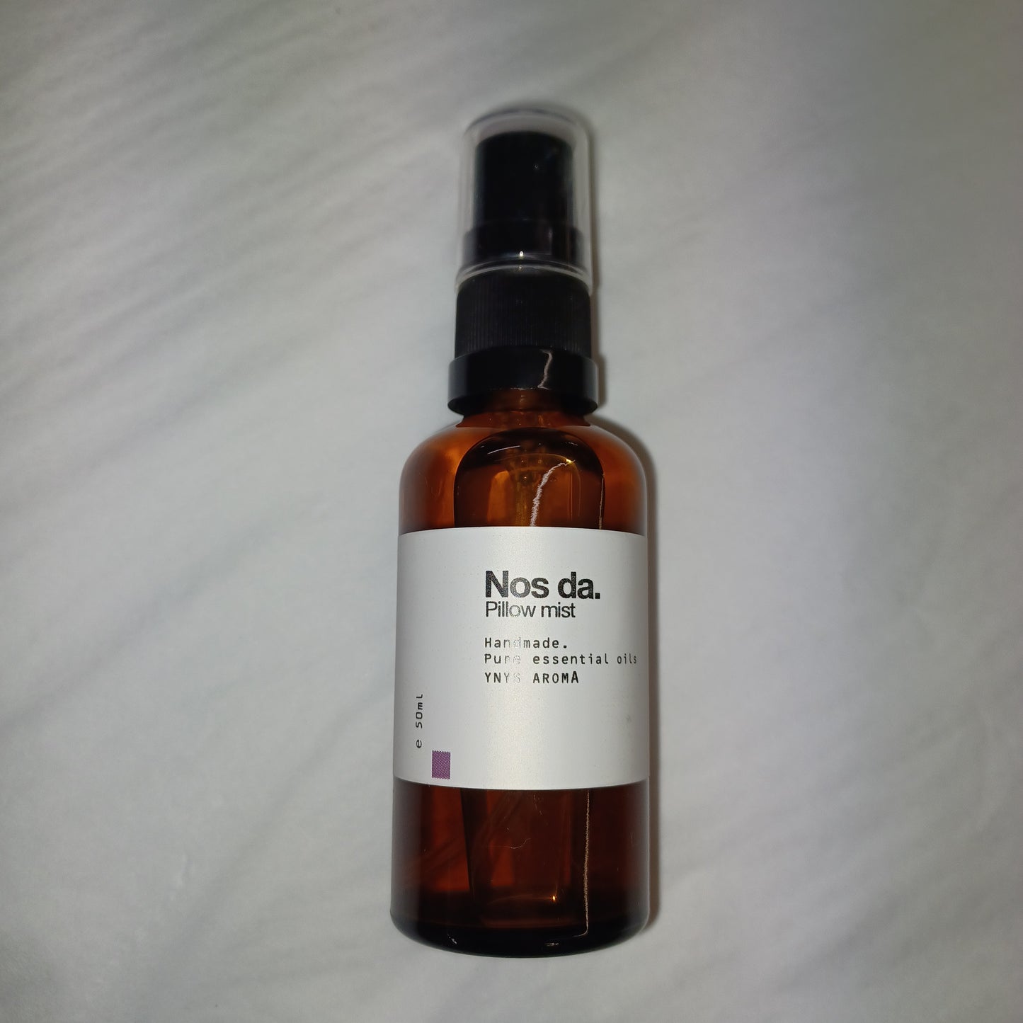 Bottle of NOSDA Pillow Mist on a white background