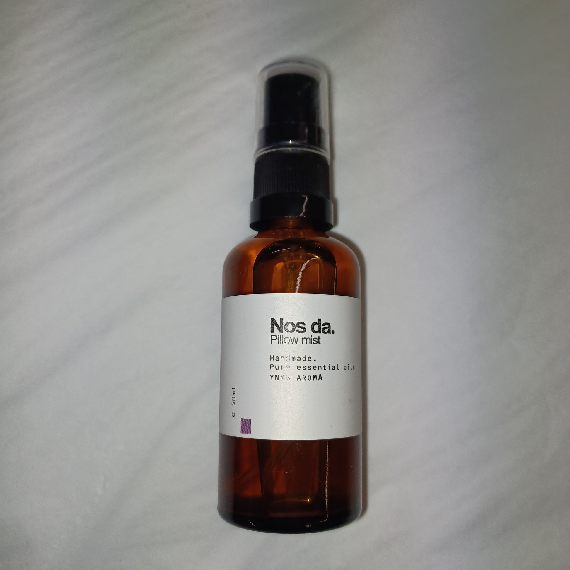 Bottle of NOSDA Pillow Mist on a white background