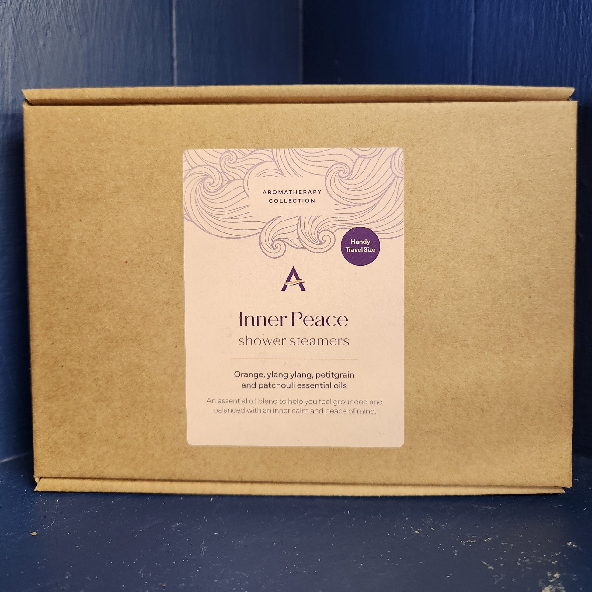 Brown cardboard box with a label on a blue wooden surface