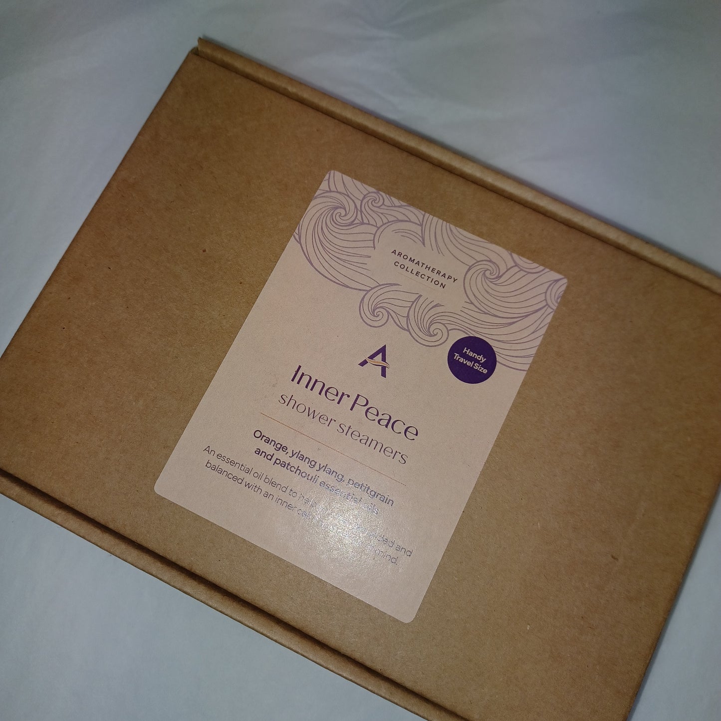 Brown box with a 'Inner Peace' label on a white background