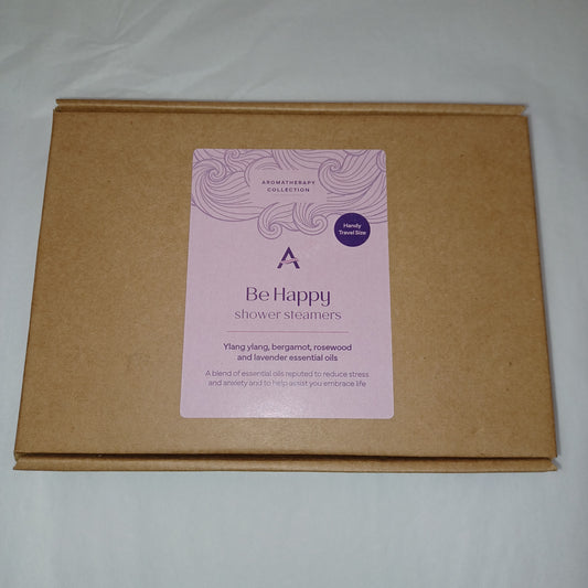 Brown cardboard box with a pink label on a light gray background