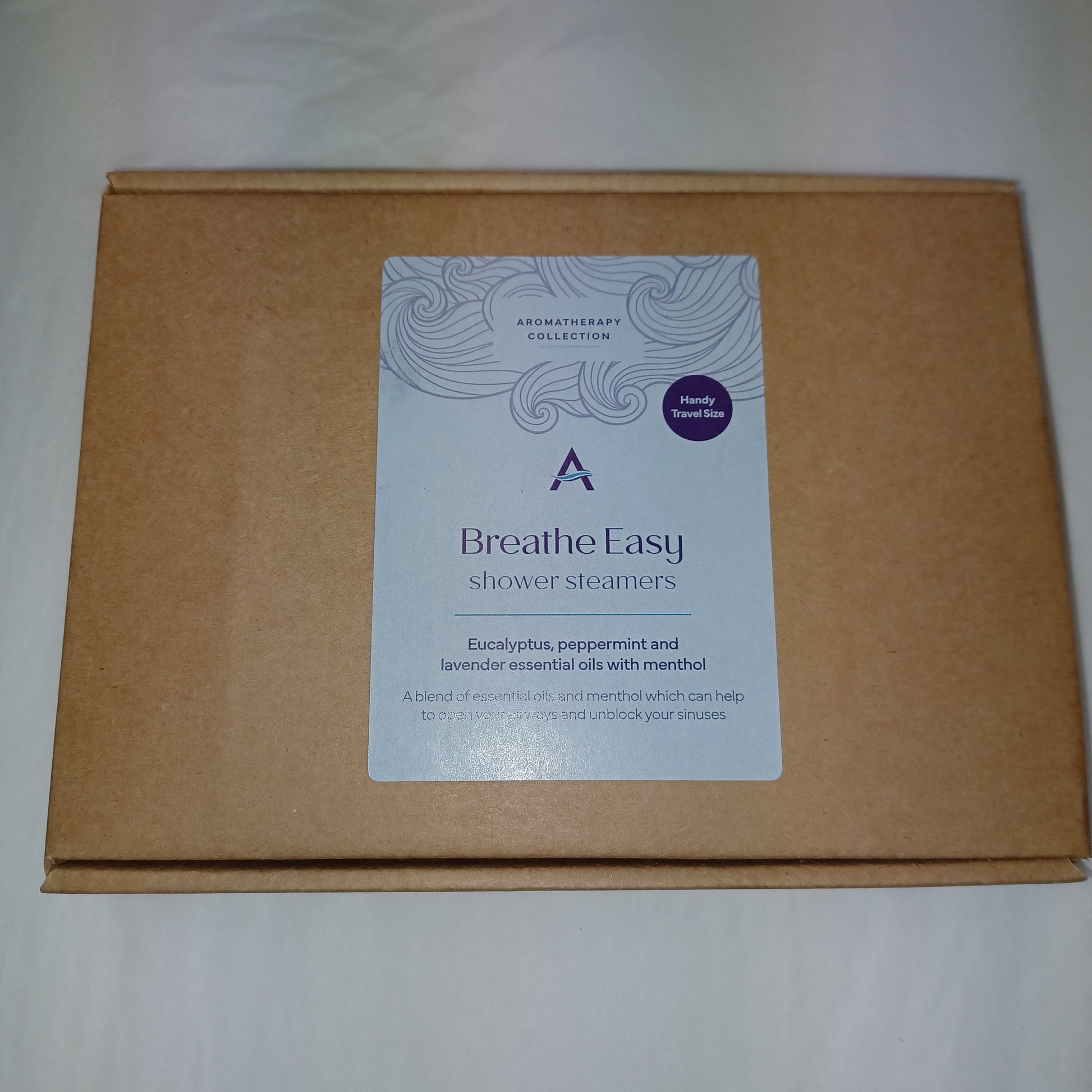 Brown cardboard box with a 'Breathe Easy' product label on a white background