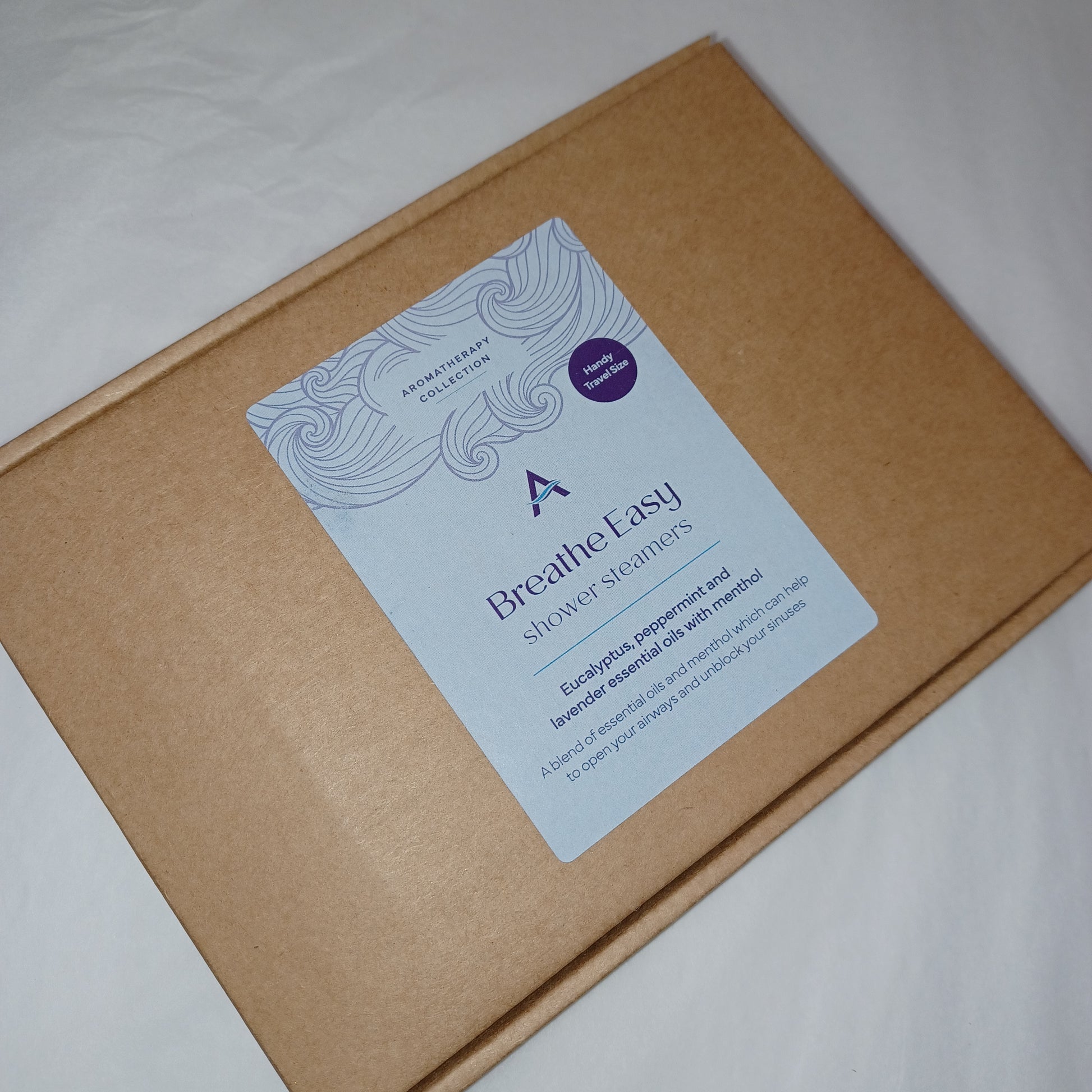 Brown box with a purple and white label on a light gray background