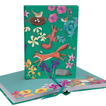Colorful notebook with animal and floral design on a white background
