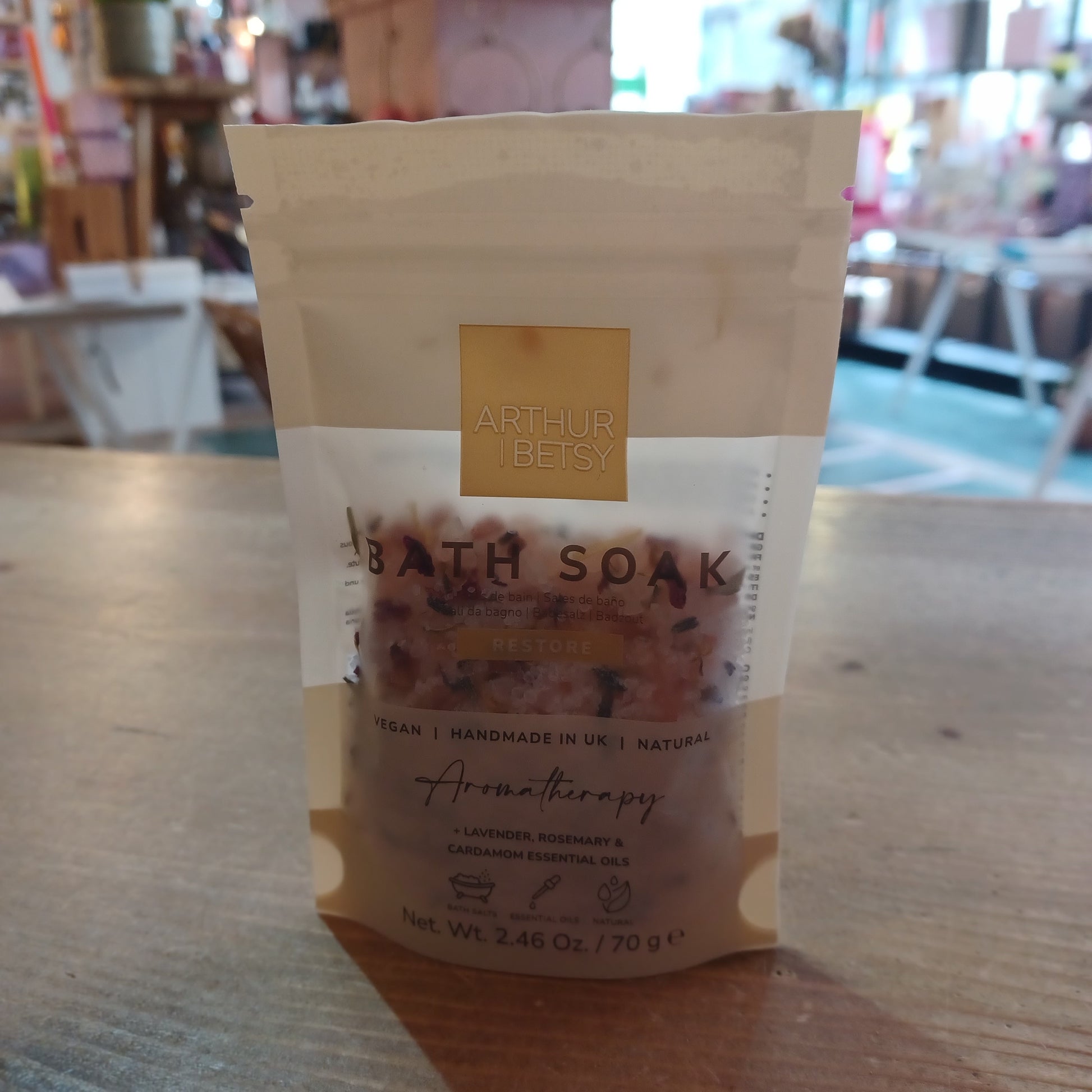 Bath soap bar with a label on a wooden surface