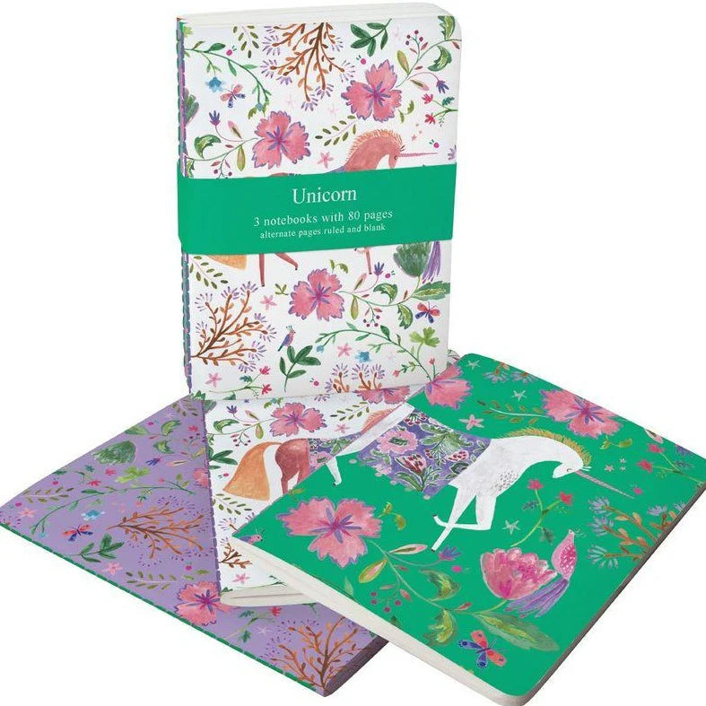 Set of notebooks with floral and unicorn designs on a white background